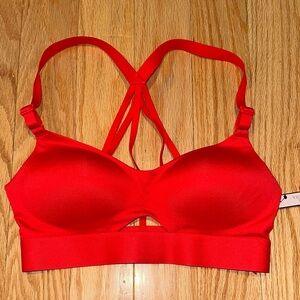 NWT Strappy Red Bra with keyhole. 32C light padding/lining & adjustable straps.